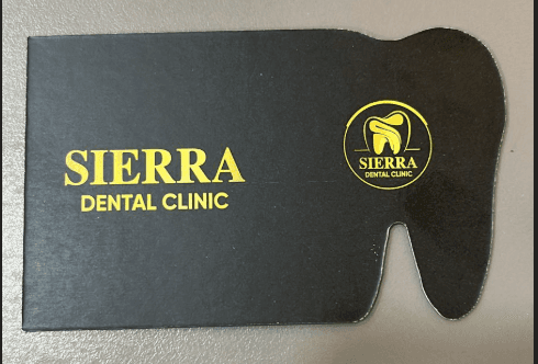 Sierra Dental Clinic logo on a tooth-shaped card